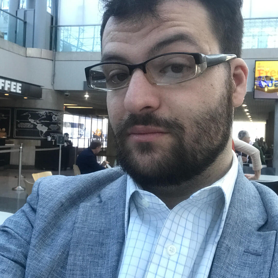 Zach is very handsome in a suit with his styled beard